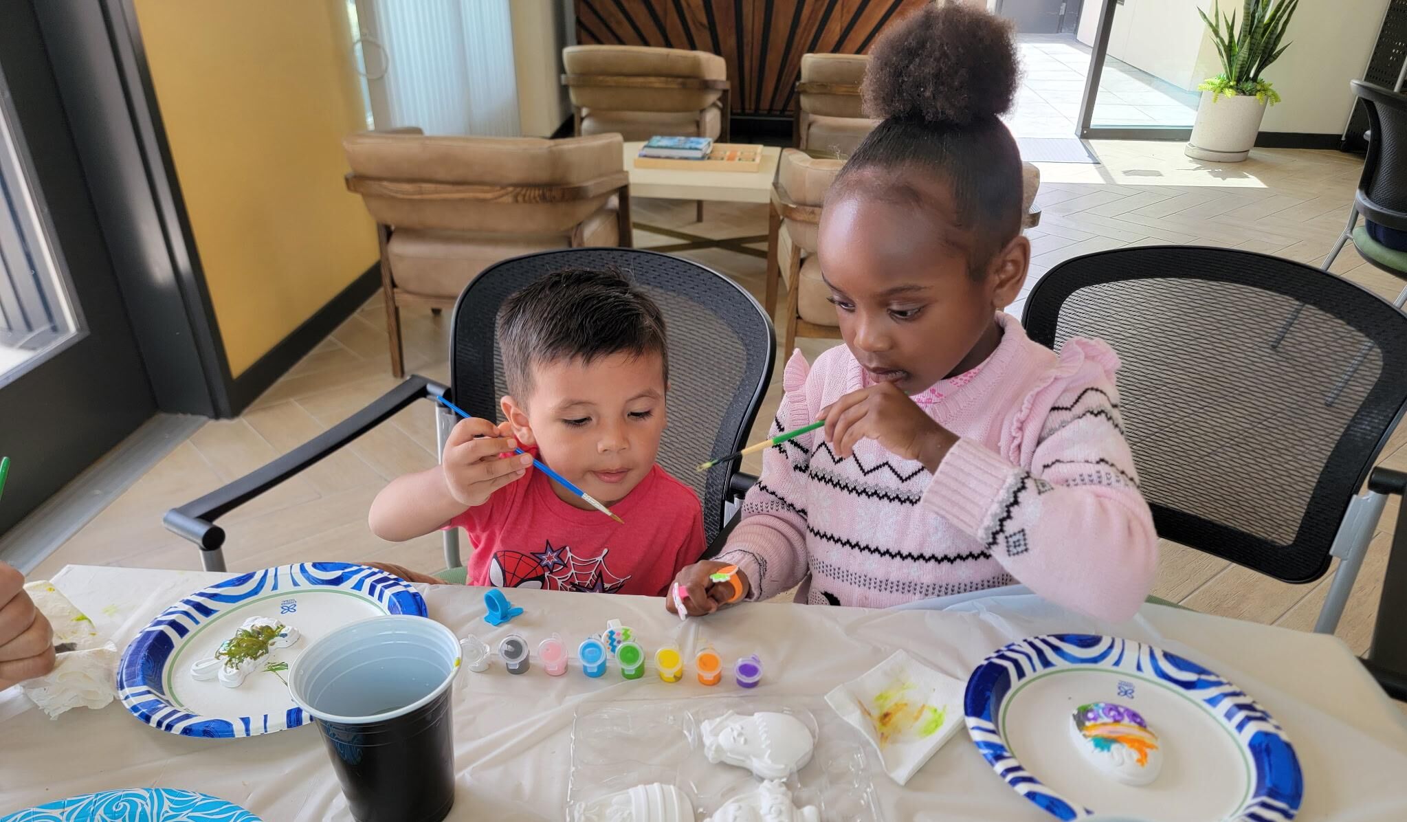 Young residents painting Mariposa Lily