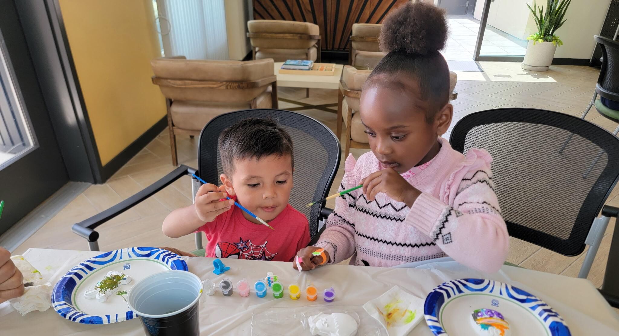 Young residents painting Mariposa Lily